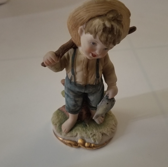 boy fishing figurine